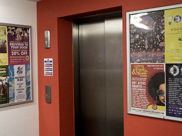 <span>Student Halls</span><i>→</i>